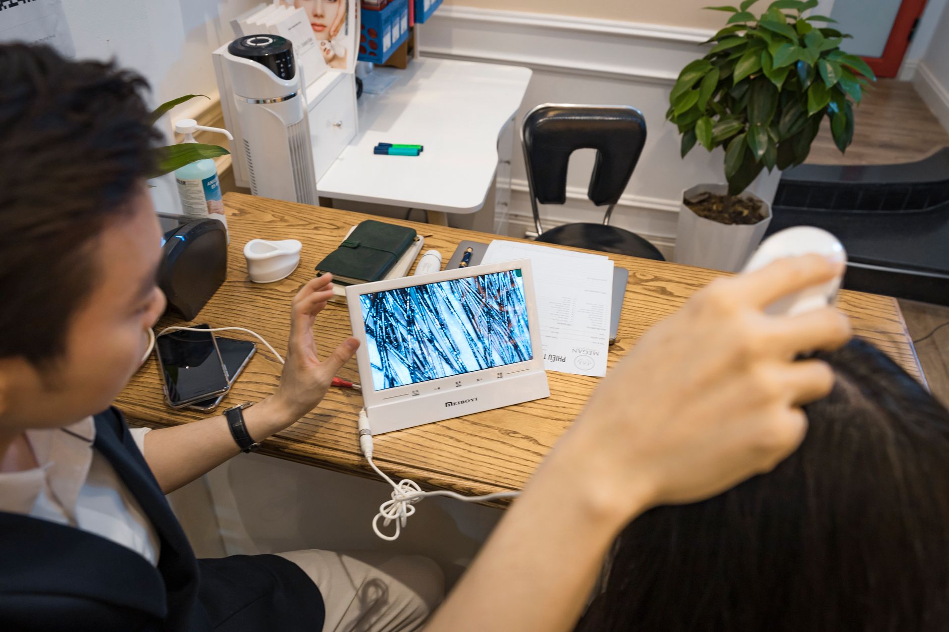 A modern office scene with a man using technology, highlighting digital connectivity and workspace design.